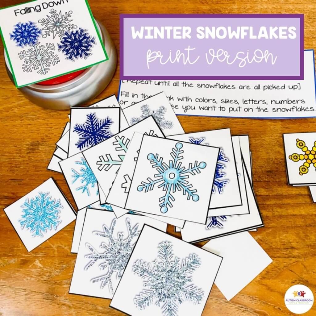 Winter snowflakes print version with cutouts of snowflakes in pile and speech generating device visual that ways "falling down"