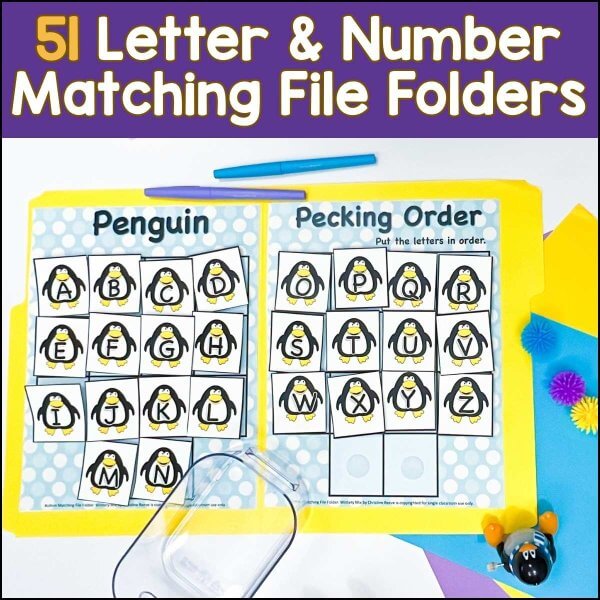 The Independent Work Stations Task Box Starter includes two yellow file folders titled Penguin and Pecking Order with penguin cards featuring uppercase A-Ž, perfect for independent work stations. Shown with colorful paper, pom-poms, and a penguin figurine.